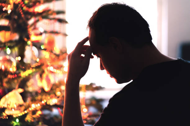 man in front of tree holiday stress and porn triggers