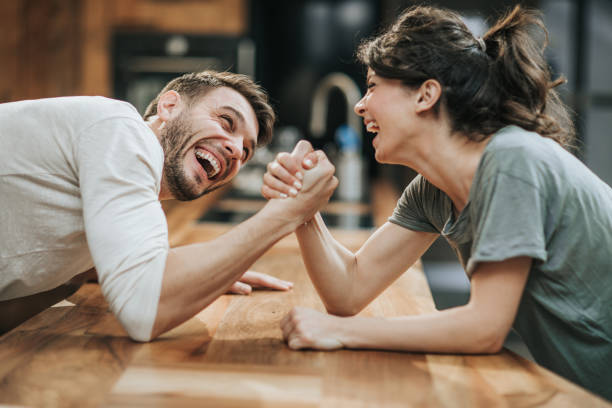 man and woman arm wrestling 7 ways to cope with holiday stress and porr